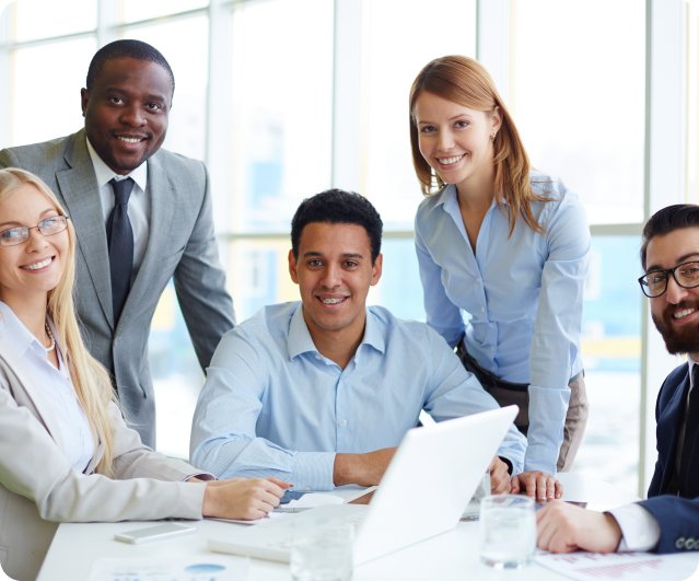 Two business professionals collaborating on documents, symbolizing teamwork and strategic planning